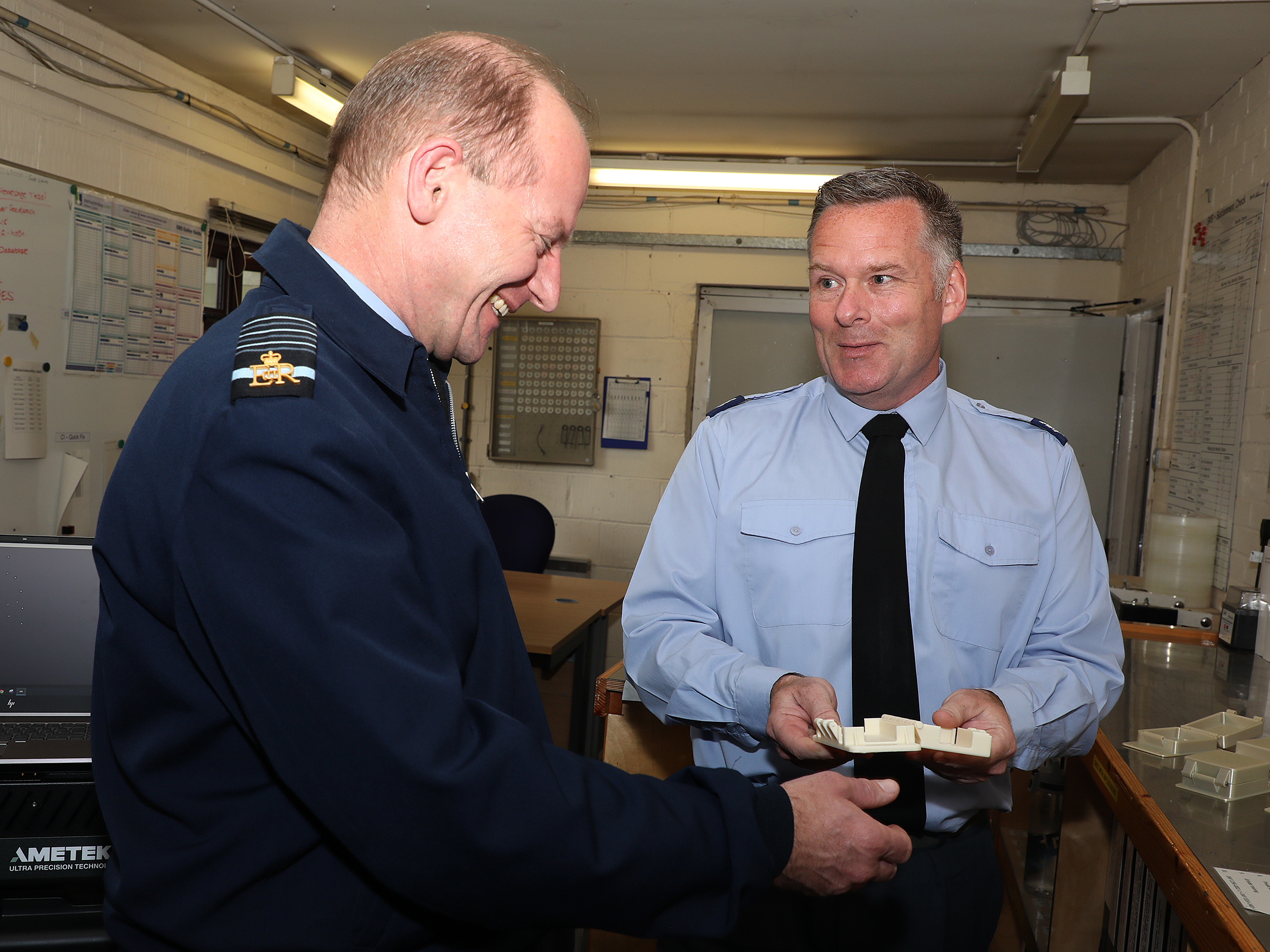 71 Inspection & Repair Squadron shows Air Chief Marshal Wigston an example of their new 3D printing technology